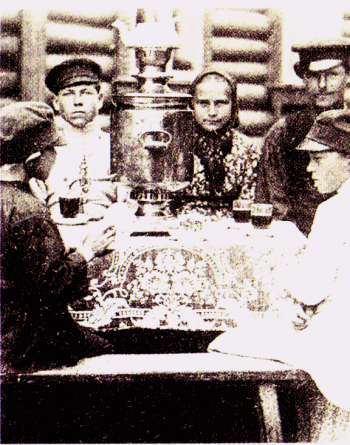 Russian family at table with samovar